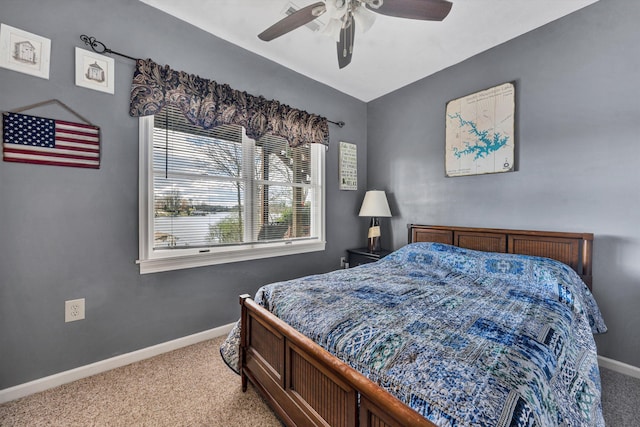 bedroom with carpet flooring, baseboards, and ceiling fan