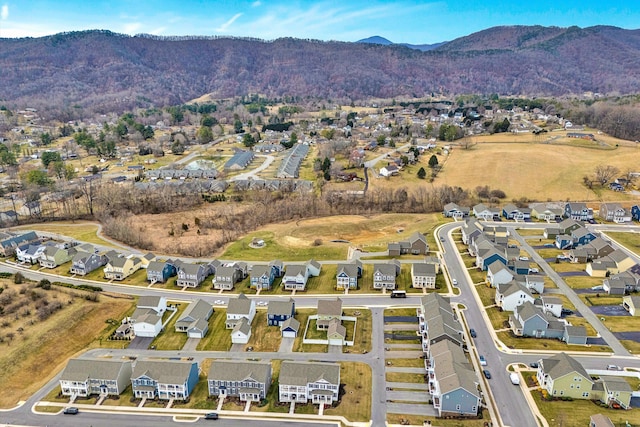 birds eye view of property with a mountain view and a residential view