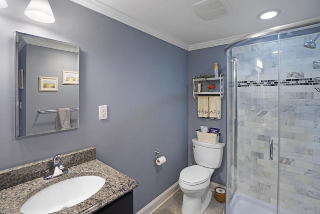 bathroom with vanity, toilet, ornamental molding, and a shower stall