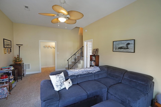 living room with stairs, visible vents, baseboards, and carpet flooring