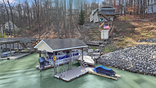 view of dock featuring stairs, a water view, and boat lift