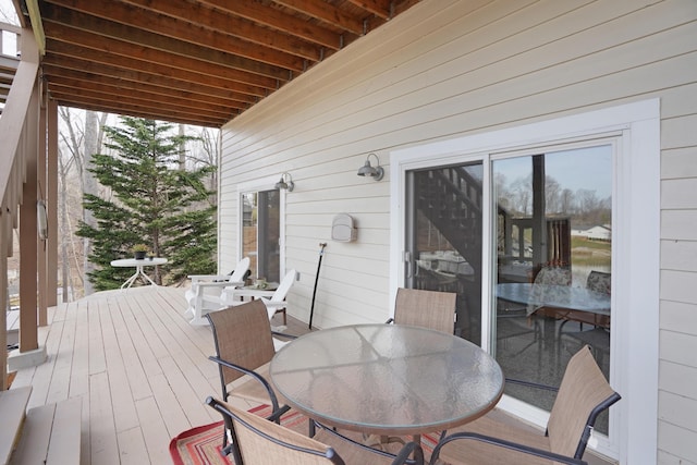 wooden deck featuring outdoor dining area