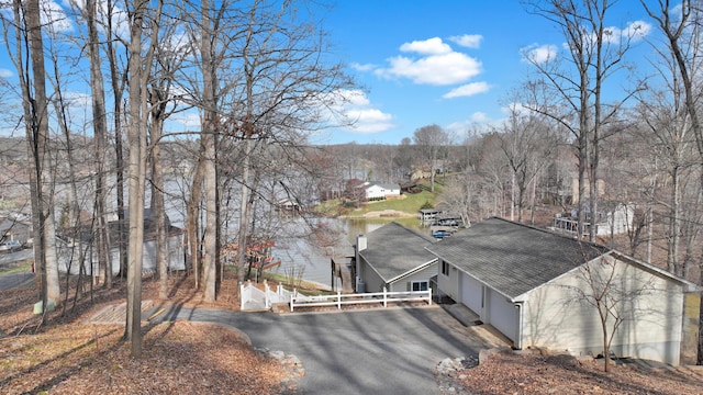 view of street featuring aphalt driveway