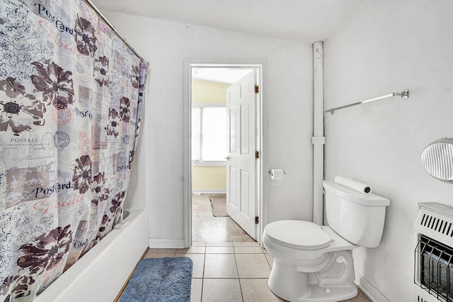 full bathroom featuring tile patterned floors, baseboards, toilet, heating unit, and shower / bath combination with curtain