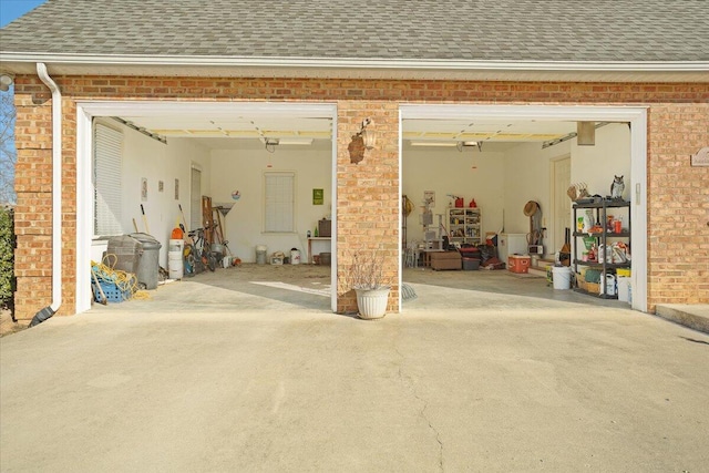 garage with concrete driveway