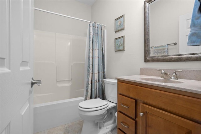 full bath with toilet, shower / bath combo, vanity, and tile patterned flooring