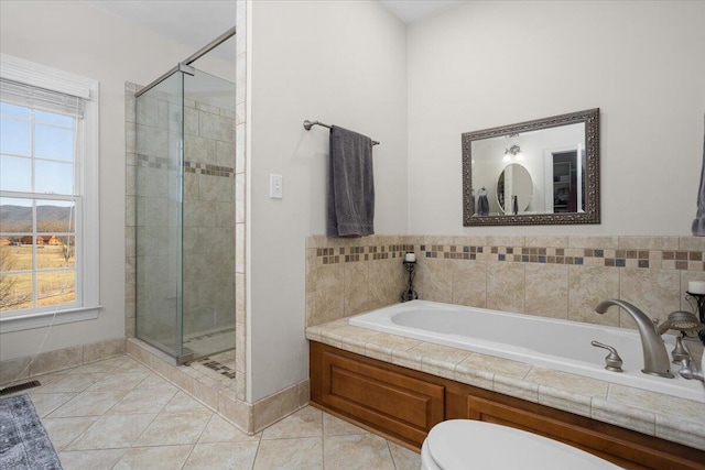 full bath featuring a bath, visible vents, a shower stall, tile patterned floors, and toilet