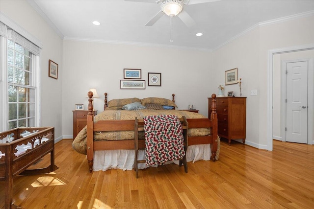 bedroom with crown molding, ceiling fan, baseboards, recessed lighting, and light wood-style floors