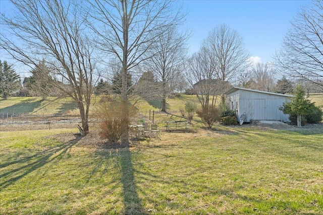 view of yard featuring an outbuilding and a pole building