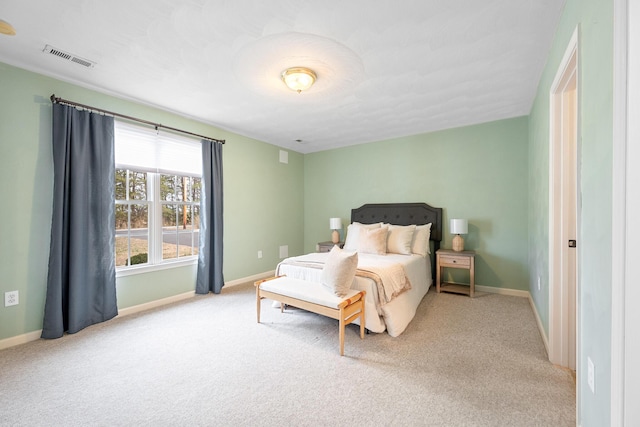 bedroom featuring visible vents, baseboards, and carpet flooring