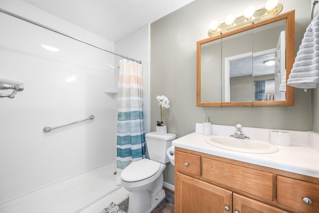 bathroom with toilet, vanity, and a shower with curtain