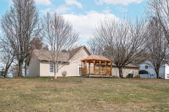 exterior space featuring a gazebo and a yard