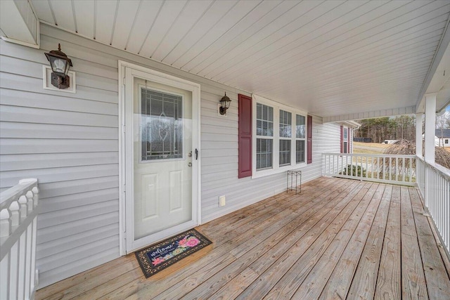 wooden terrace featuring a porch