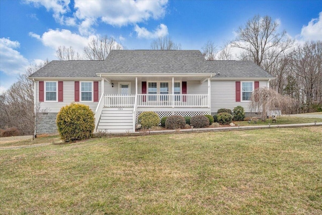 ranch-style home featuring a porch, a front yard, and a shingled roof