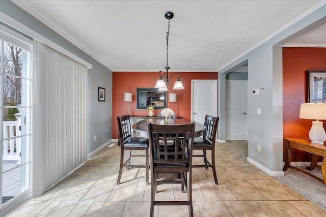 dining room with light tile patterned floors, baseboards, and ornamental molding