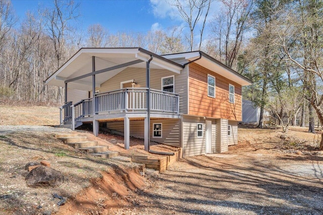 view of side of property featuring stairway