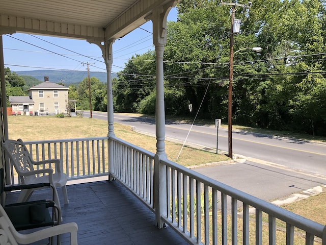 wooden terrace featuring a porch