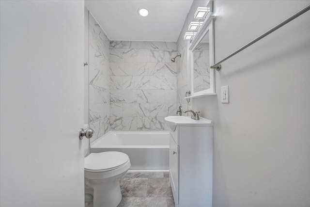 bathroom featuring toilet, vanity, and bathing tub / shower combination