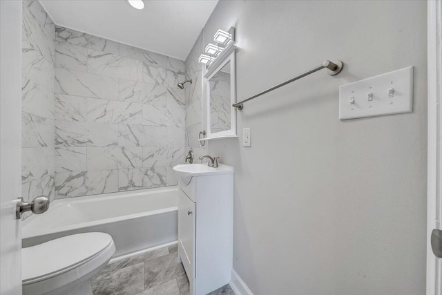 bathroom featuring tub / shower combination, toilet, and vanity