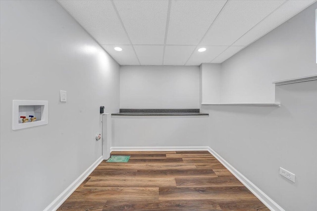 laundry area featuring washer hookup, laundry area, wood finished floors, and baseboards