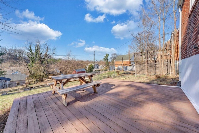 wooden terrace featuring fence