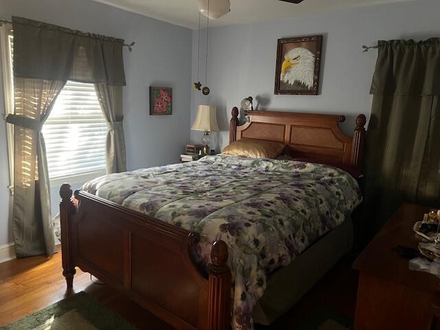 bedroom with light wood-style floors and ceiling fan