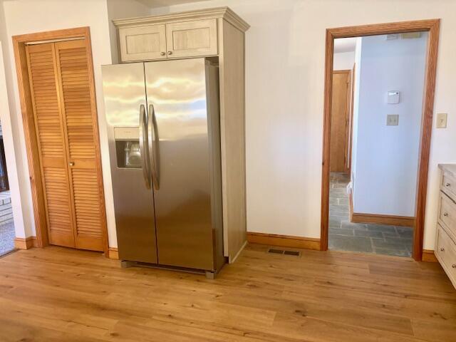 182 Dogwood Ln, Troutville, VA 24175 - kitchen featuring visible vents, baseboards, stainless steel refrigerator with ice dispenser, and light wood finished floors
