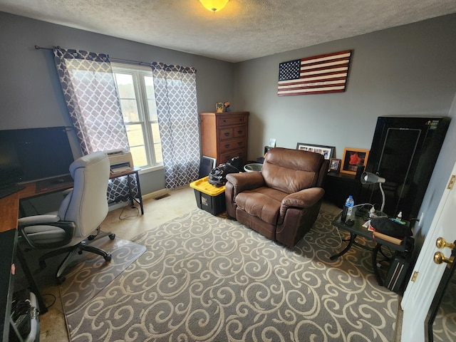 office with visible vents and a textured ceiling