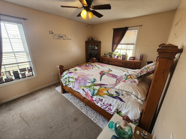 bedroom with carpet flooring, a ceiling fan, and baseboards