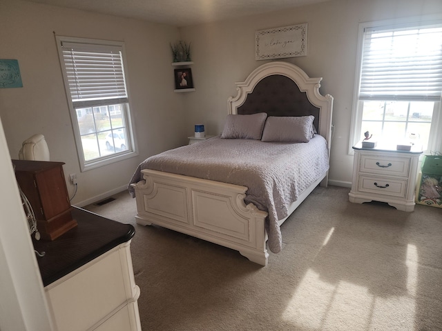 bedroom with baseboards and carpet floors