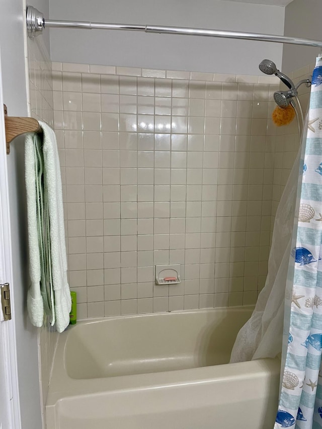 bathroom featuring shower / bathtub combination with curtain