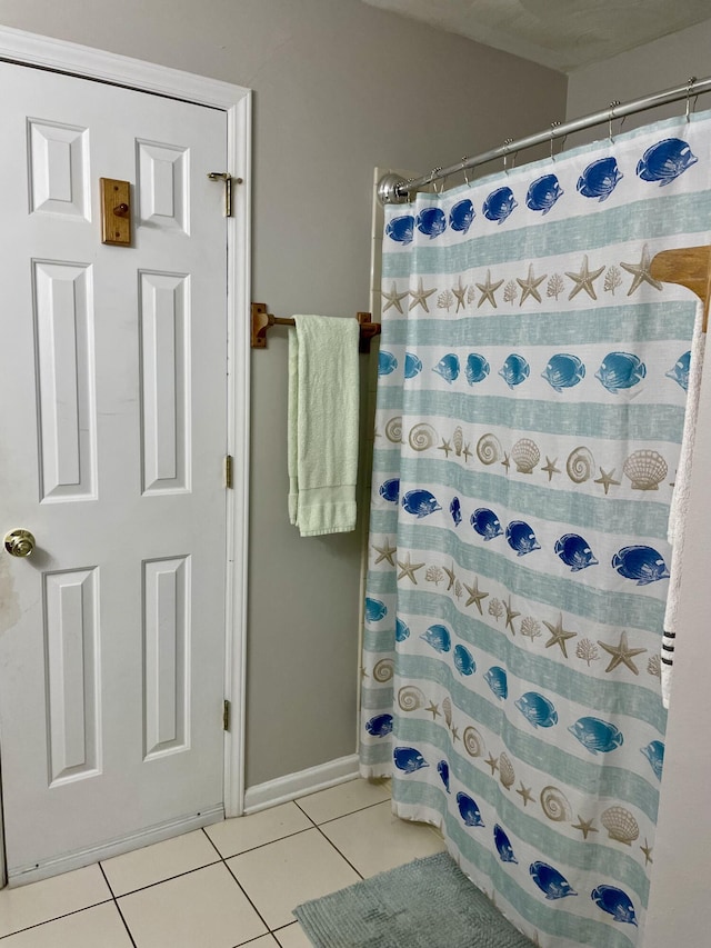 bathroom featuring tile patterned floors and a shower with curtain