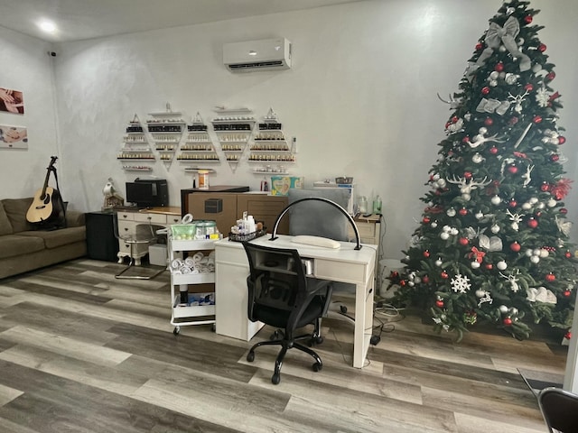 office area featuring wood finished floors and a wall mounted AC