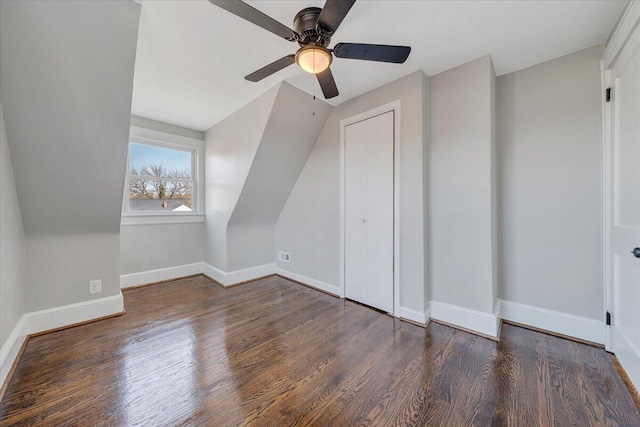 additional living space featuring a ceiling fan, wood finished floors, and baseboards