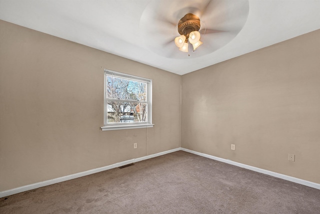 spare room featuring visible vents, ceiling fan, baseboards, and carpet floors