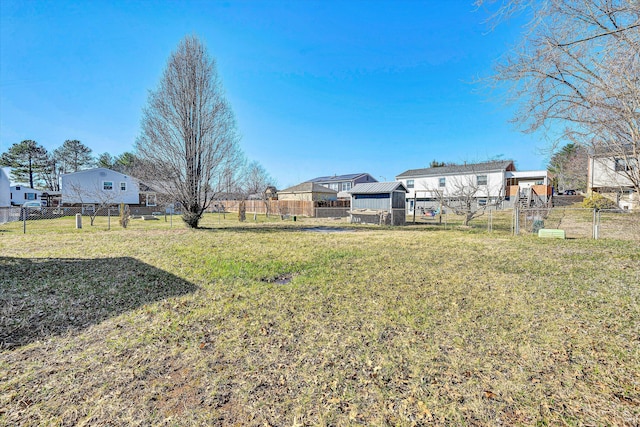 view of yard featuring a residential view and fence