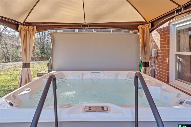 view of swimming pool with a gazebo and a hot tub