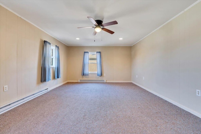 carpeted spare room with baseboards, ornamental molding, baseboard heating, a ceiling fan, and a baseboard radiator