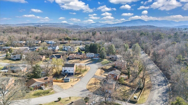 bird's eye view with a forest view, a mountain view, and a residential view