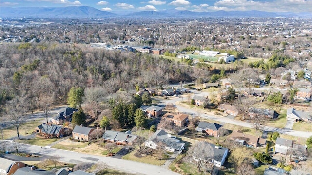 drone / aerial view featuring a residential view and a mountain view