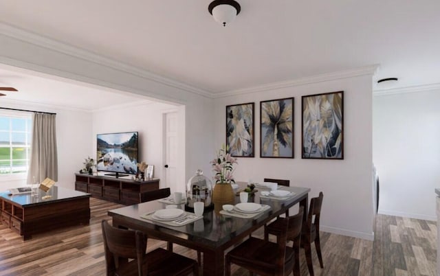 dining space with crown molding, wood finished floors, and baseboards