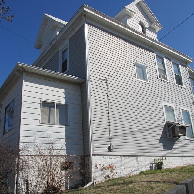 view of home's exterior featuring cooling unit