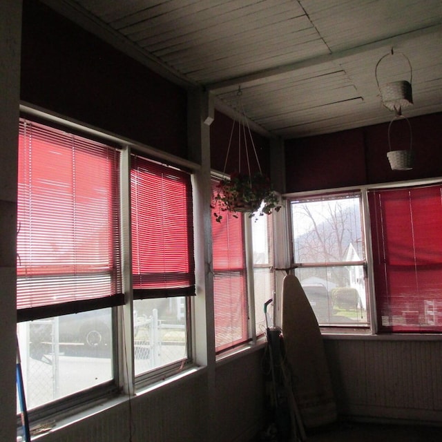 unfurnished sunroom featuring a chandelier