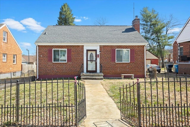 view of front facade with fence, roof with shingles, a chimney, a front lawn, and brick siding