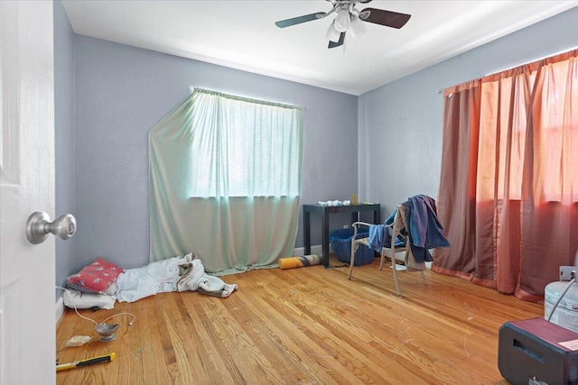 bedroom with wood finished floors and ceiling fan