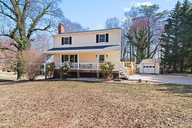 traditional-style house with a porch, a chimney, a front lawn, an outdoor structure, and a detached garage