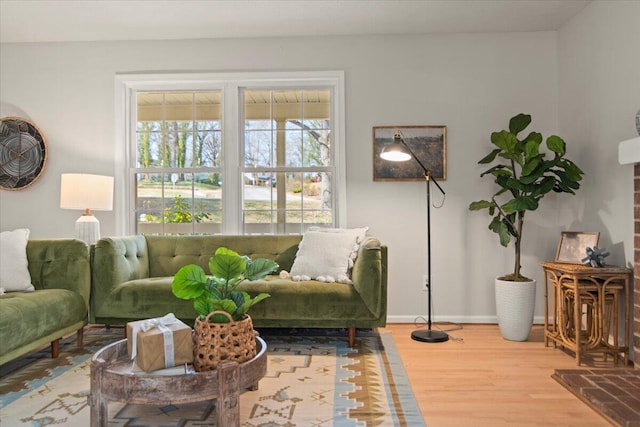 living room featuring baseboards and wood finished floors