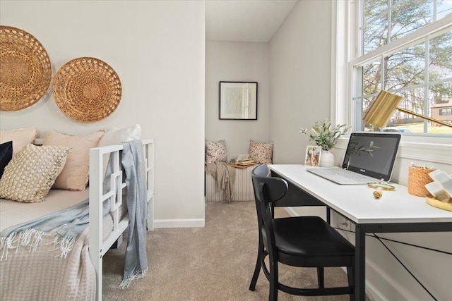 office space featuring light colored carpet and baseboards