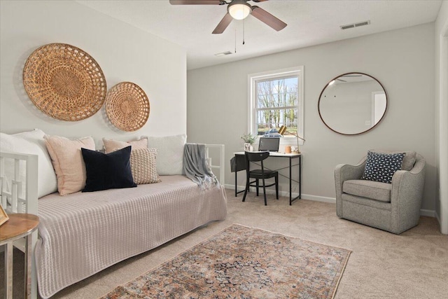 carpeted bedroom featuring visible vents, baseboards, and ceiling fan