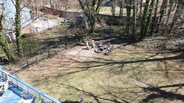 view of yard with an outdoor fire pit